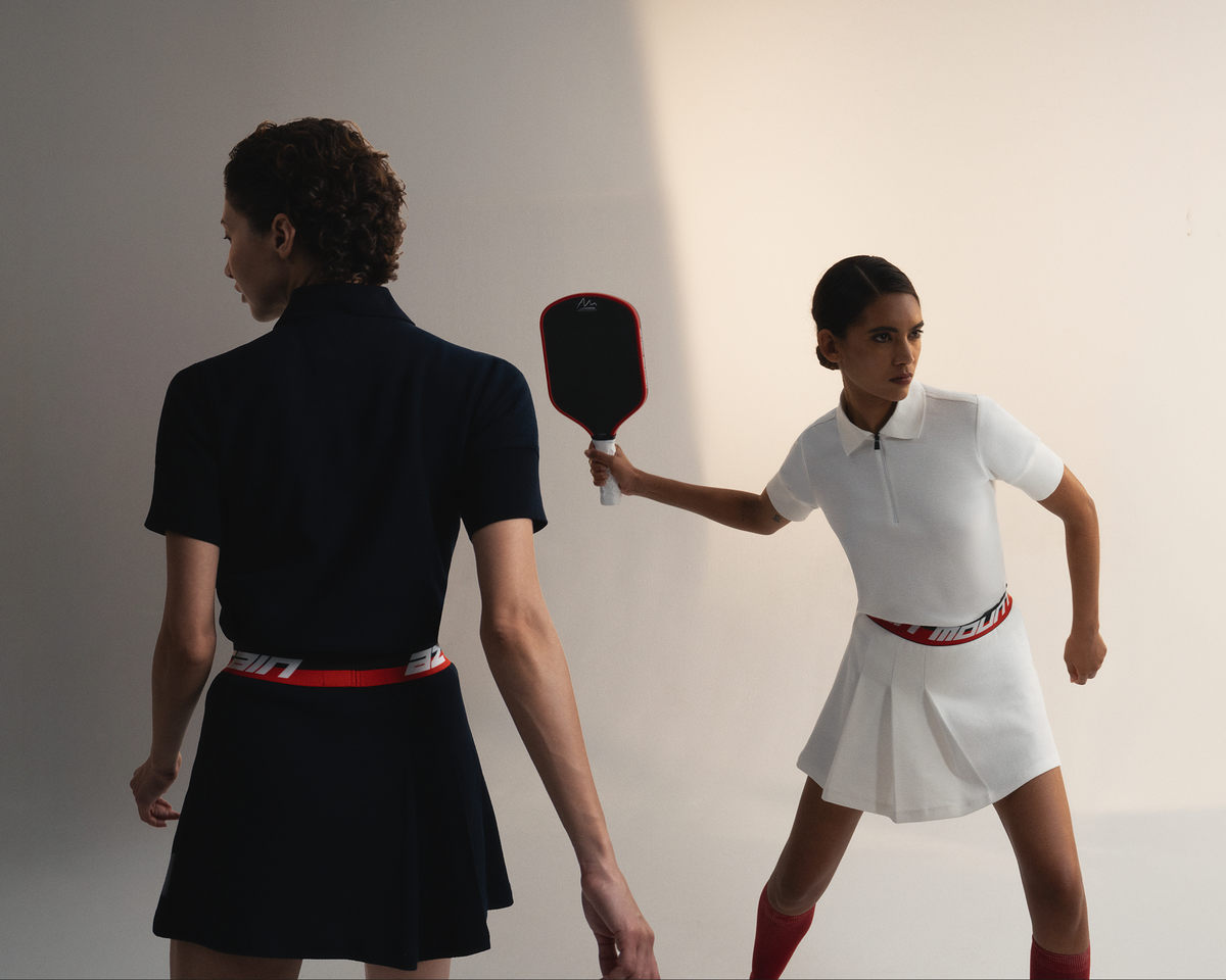 Woman in Sport Tech outfit playing pickle ball.