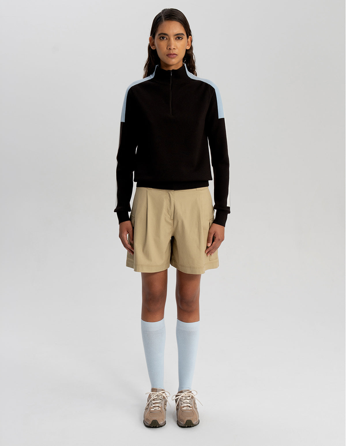 Person wearing the Moab Khaki Sport Tech short with a black Sport Tech Jacker @hover