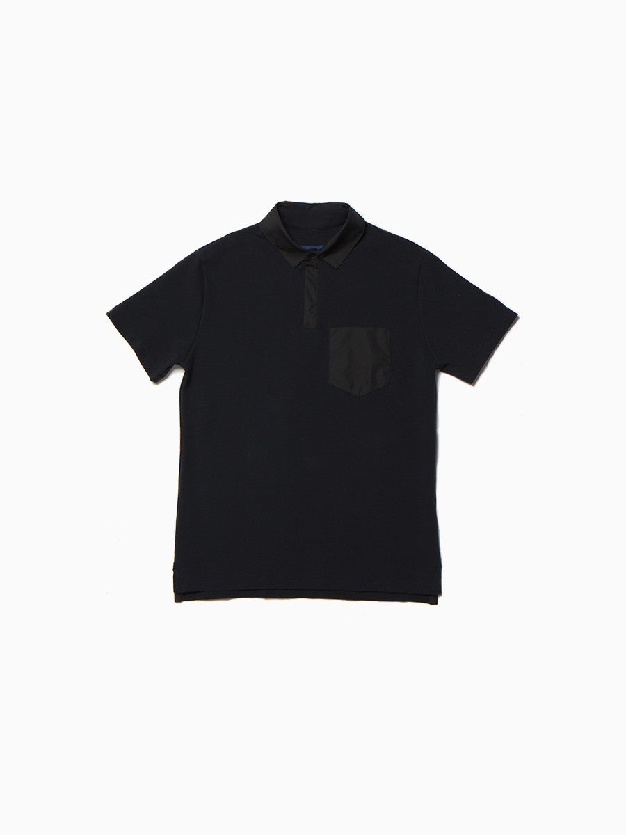 Black short-sleeve polo with classic collar and chest pocket.